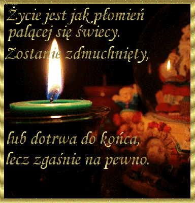 Zielony palący się znicz na cmentarzu